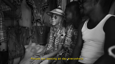 a group of people standing around each other