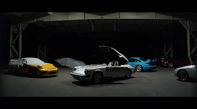 a group of cars parked in a garage