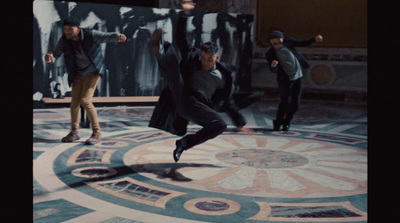 a group of men standing on top of a marble floor