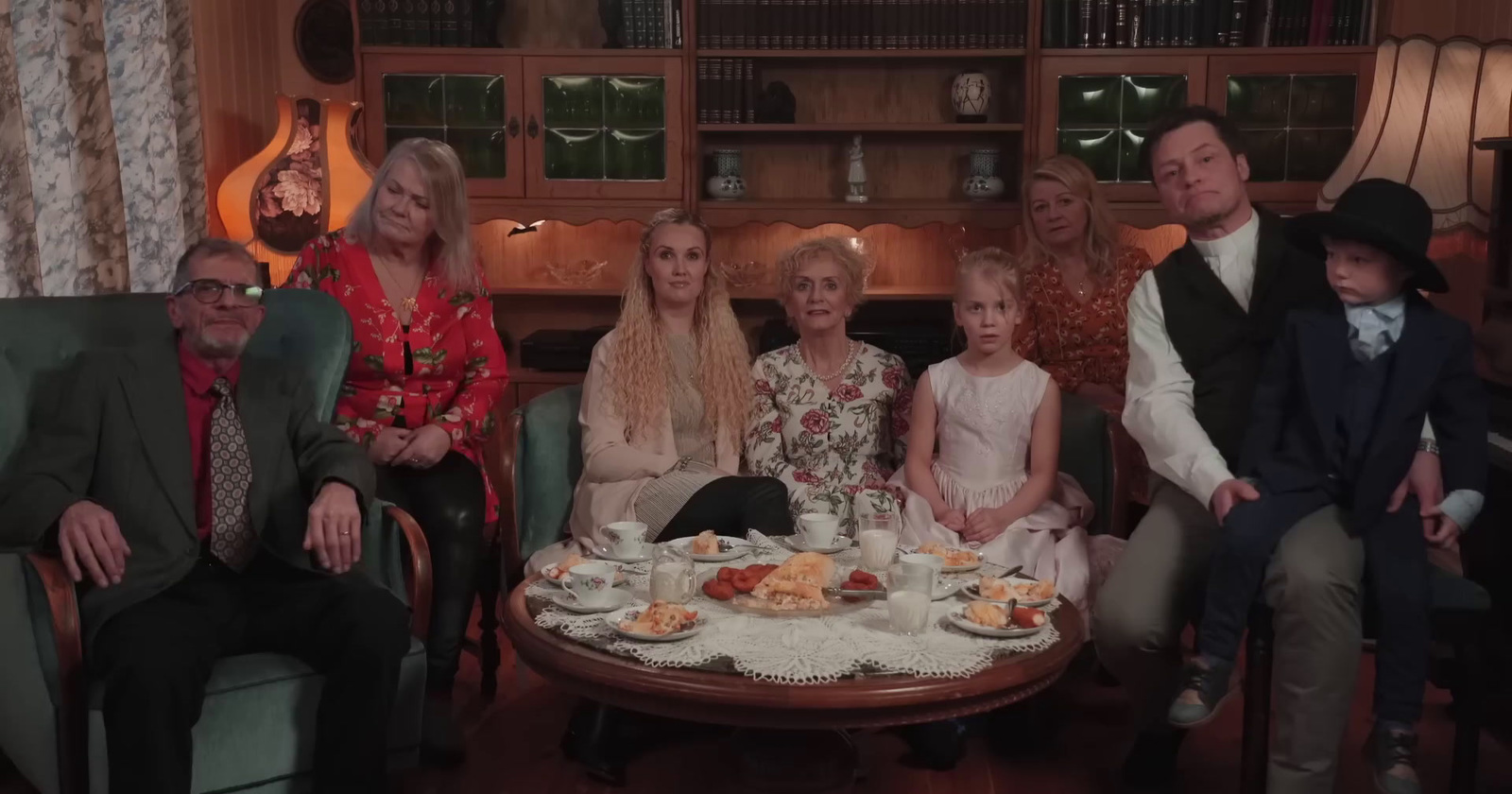 a group of people sitting around a table