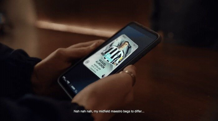 a person holding a cell phone with a picture on the screen