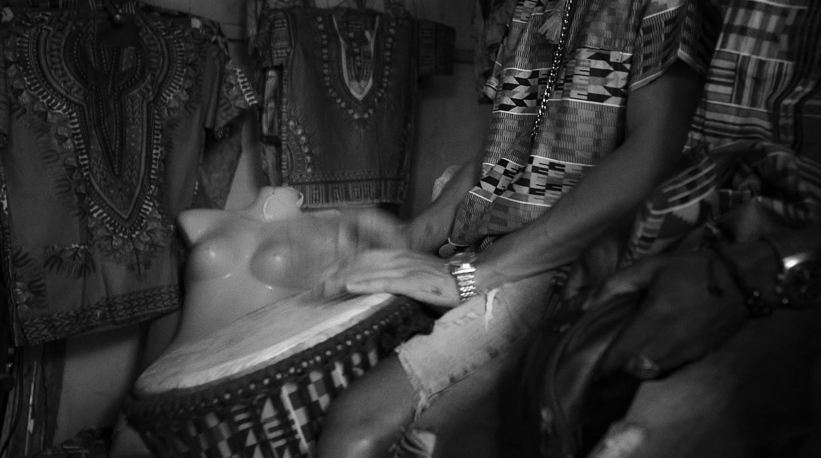 a man is washing a woman's face in a tub