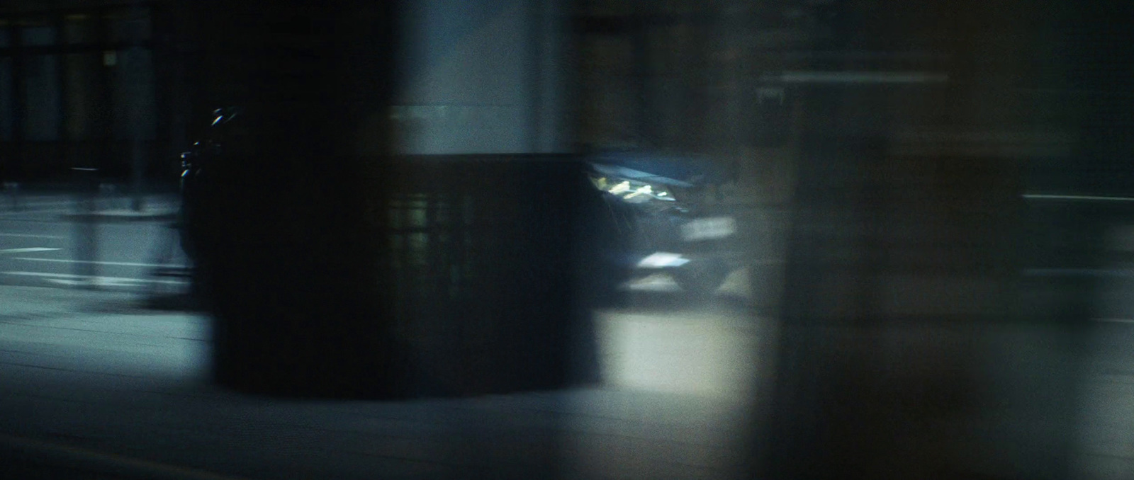 a blurry photo of a car on a city street