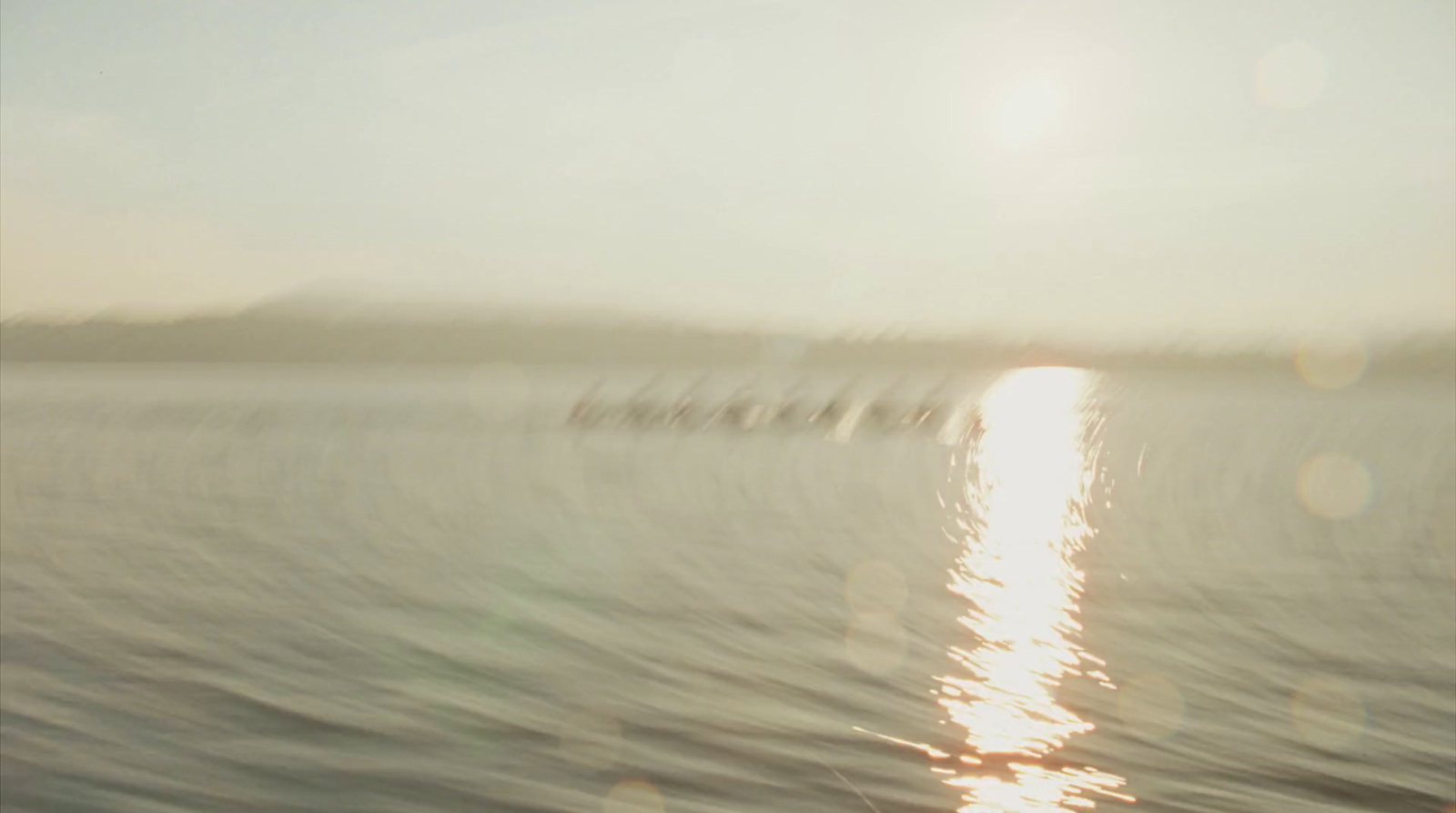 a large body of water with a bunch of boats in the distance