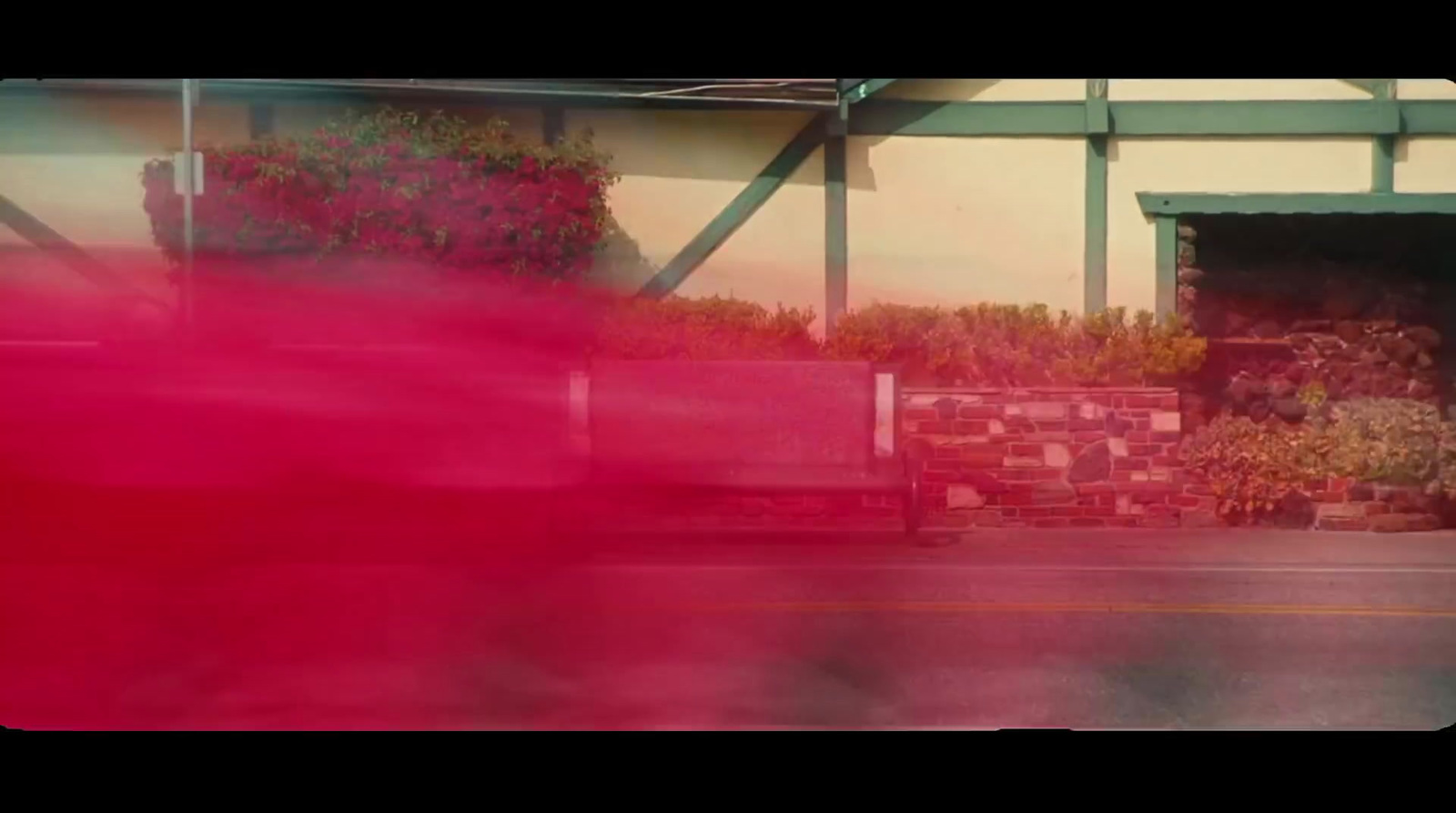 a blurry photo of a red truck parked in front of a building