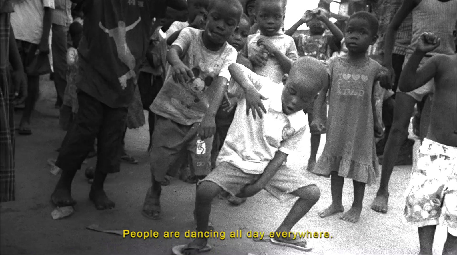 a black and white photo of a group of children