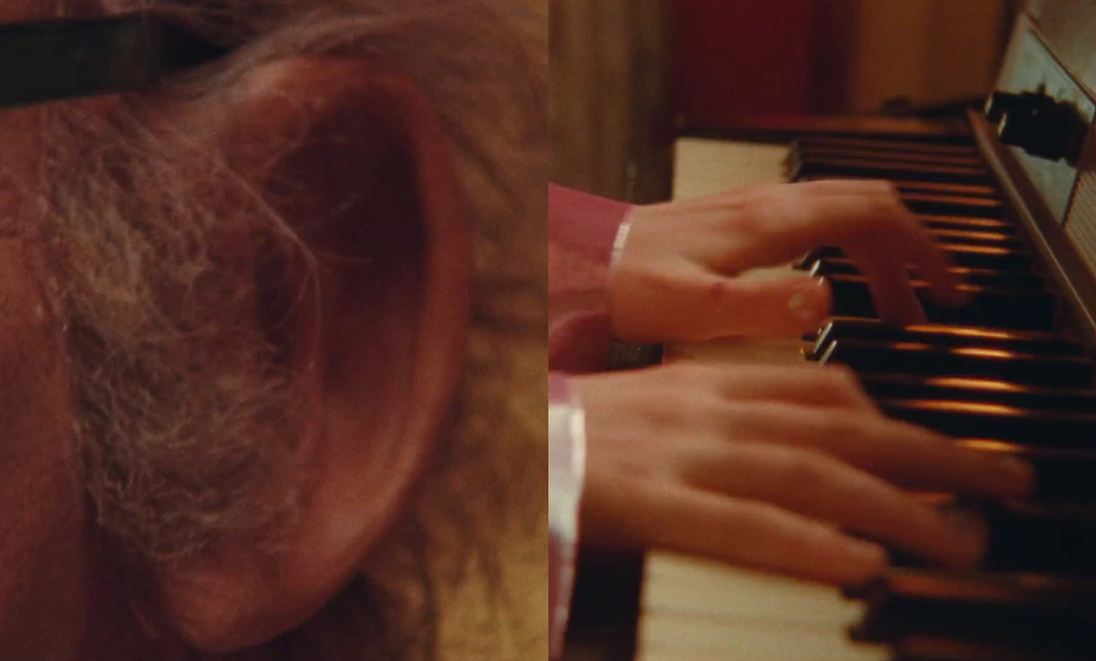 a close up of a person playing a piano