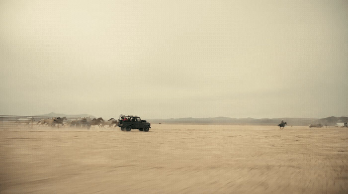 a group of people riding on the back of a truck