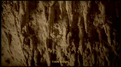 a close up of a rock face in the dark