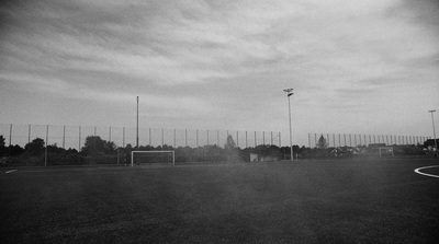 a black and white photo of a soccer field