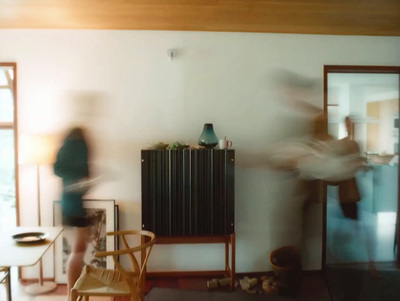 a blurry photo of people in a living room