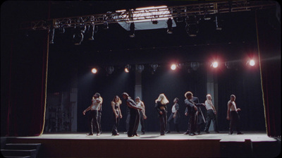 a group of people standing on top of a stage