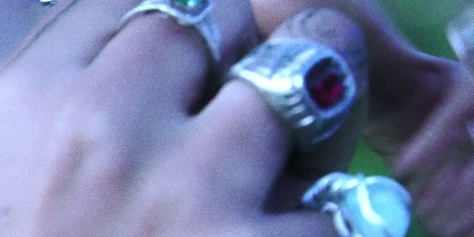 a close up of a person wearing a ring