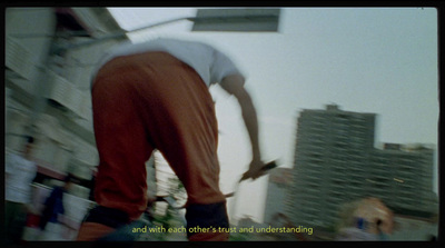 a man riding a skateboard down the side of a building