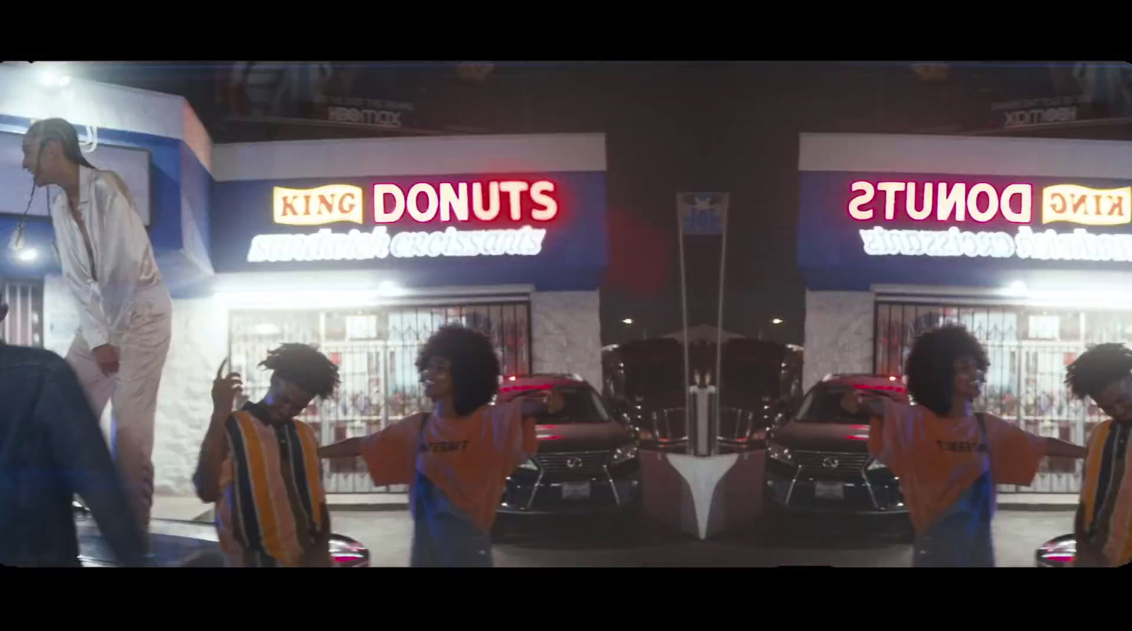 a couple of people standing in front of a store