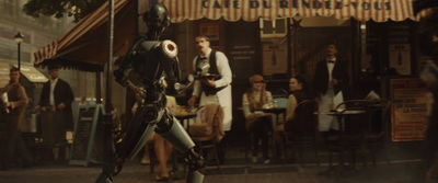 a robot standing in front of a crowd of people