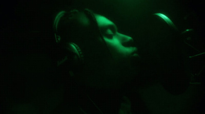 a person wearing headphones in a dark room