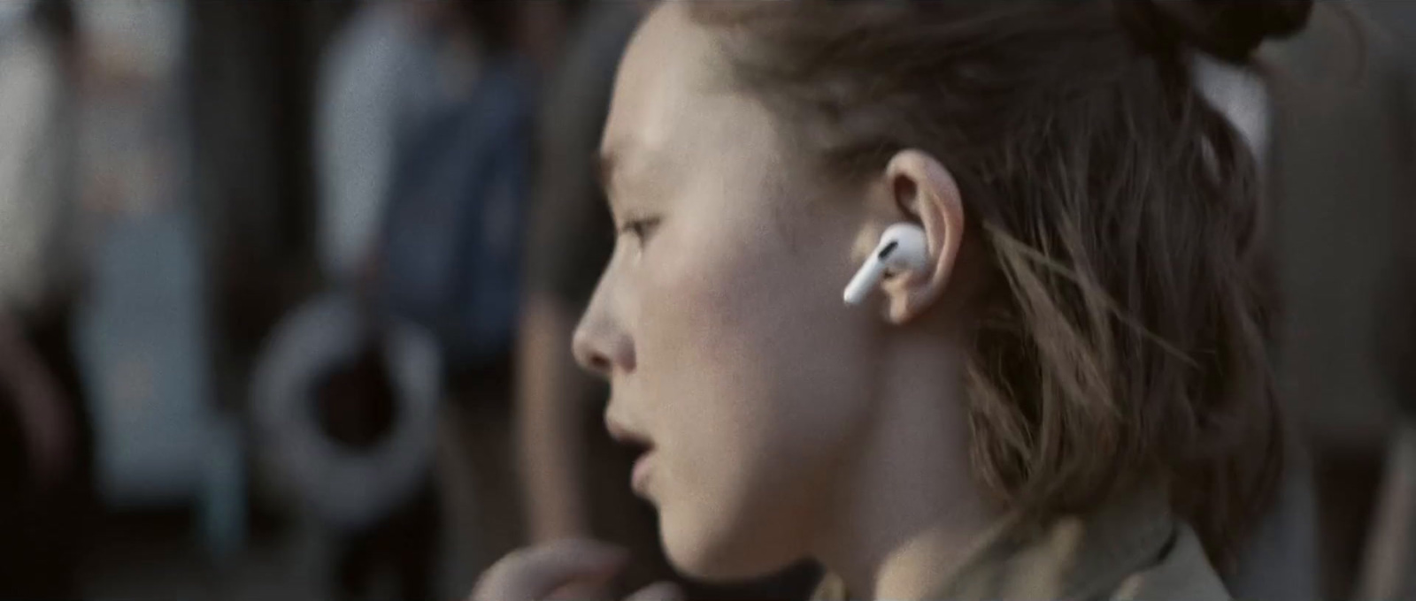 a young girl wearing a pair of ear buds