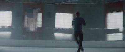 a blurry photo of a person running in a building