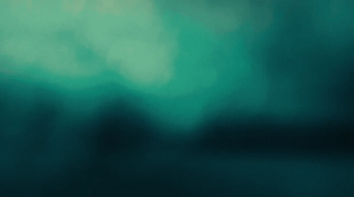 a blurry image of a blurry green background