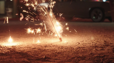 a close up of a sparkler on the ground