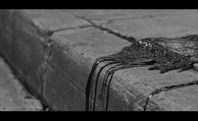 a black and white photo of a piece of concrete