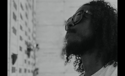 a black and white photo of a man wearing sunglasses