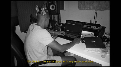 a person sitting at a desk with a laptop