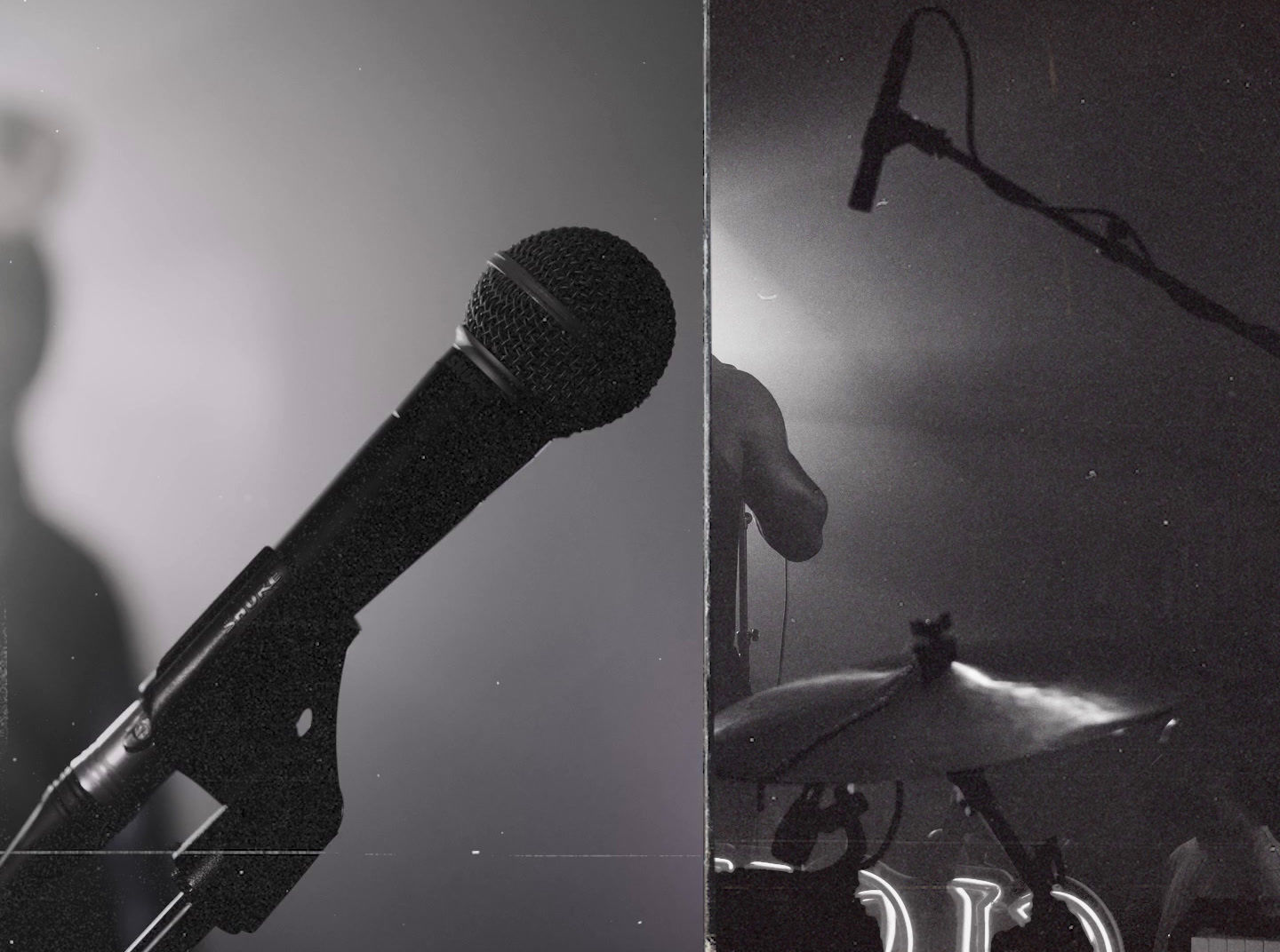 a black and white photo of a microphone and a microphone stand