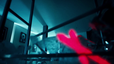 a blurry image of a red object in a room