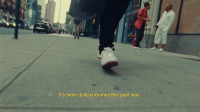 a person riding a skateboard down a city street