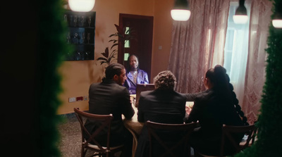 a group of people sitting around a table