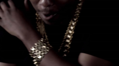 a man wearing a gold chain around his neck