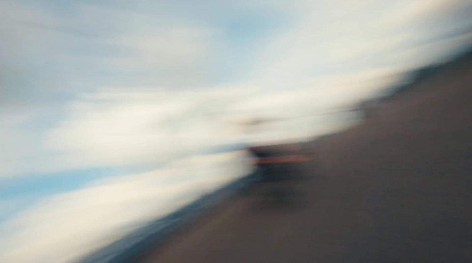 a blurry photo of a person riding a skateboard