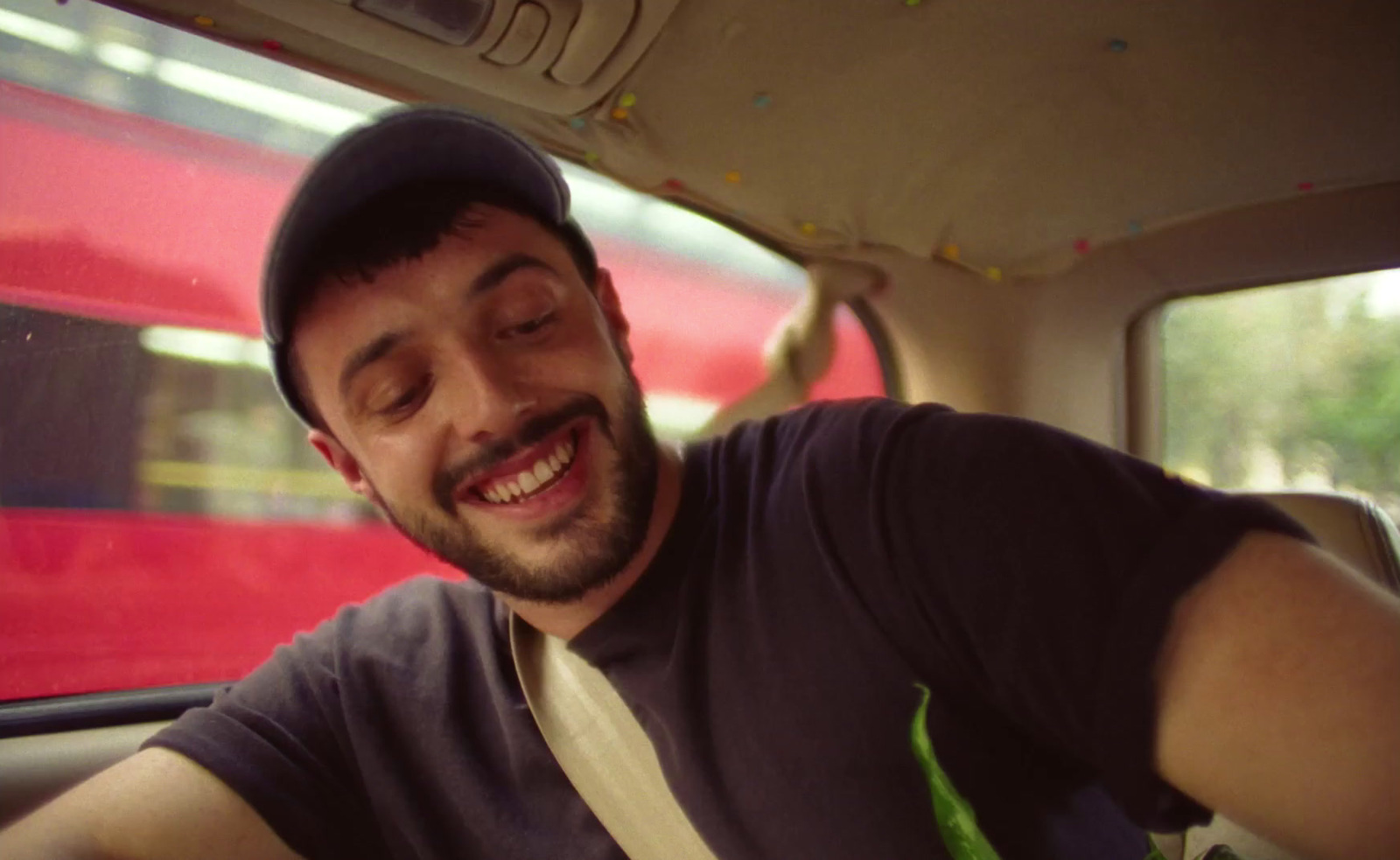 a man sitting in the back seat of a car