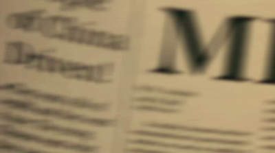 a close up of a newspaper with the word mm on it