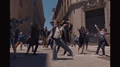 a group of people dancing in the street