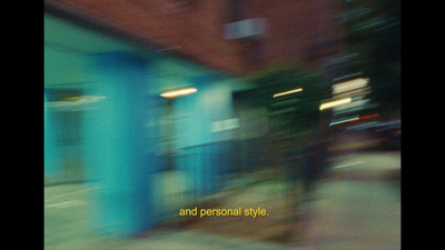 a blurry photo of a blue building with the words and personal style