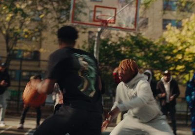 a group of young men playing a game of basketball