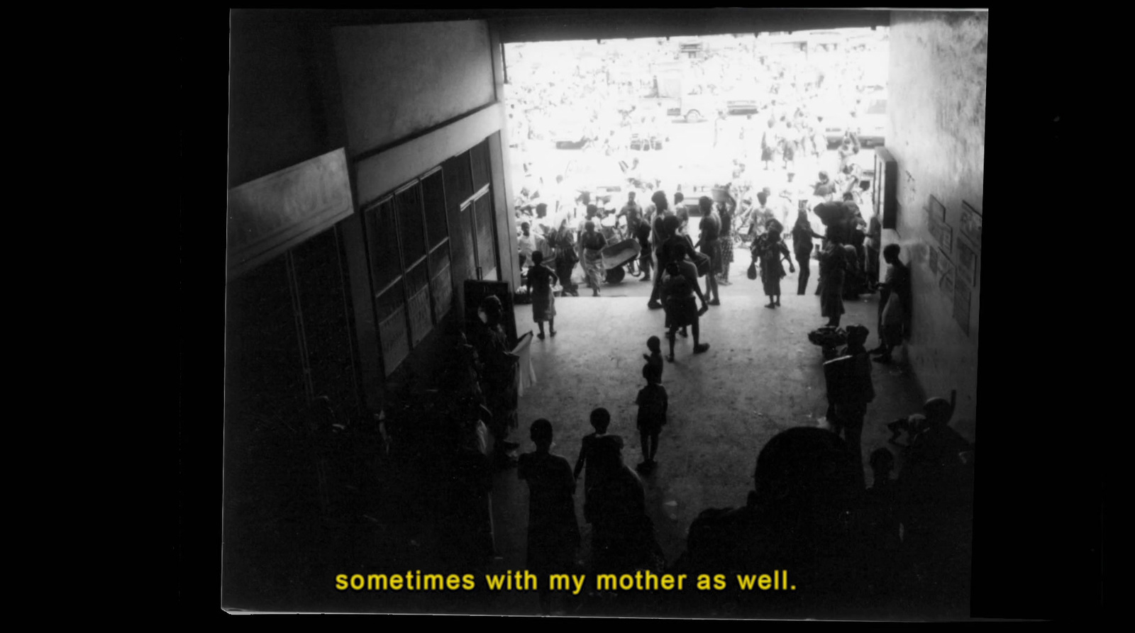 a black and white photo of a crowd of people