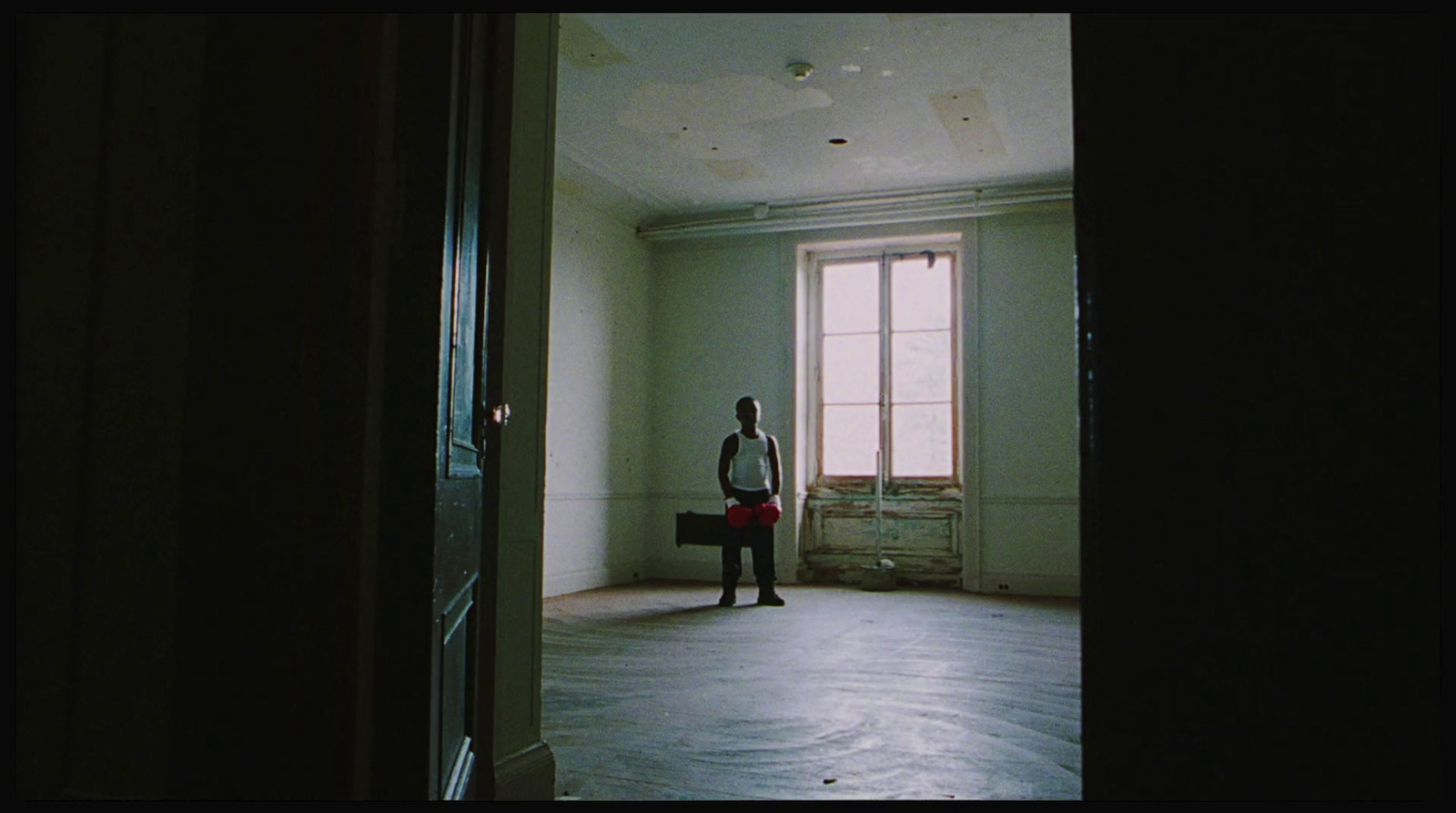 a person standing in a room with a window