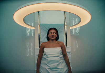 a woman in a white towel in a blue room