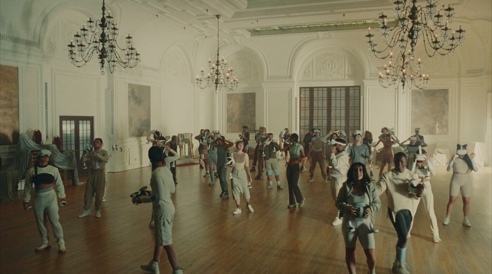 a group of people dancing in a large room