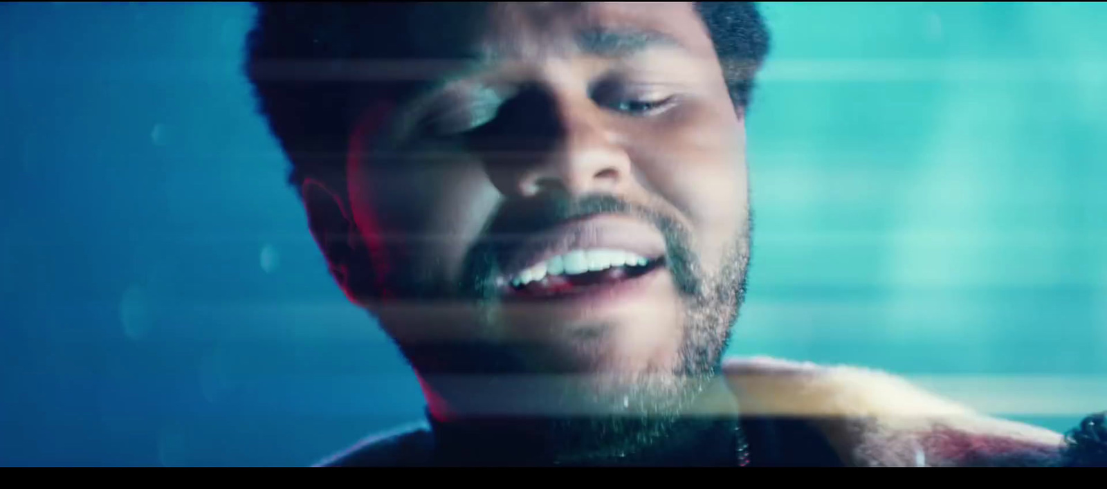 a close up of a person brushing his teeth