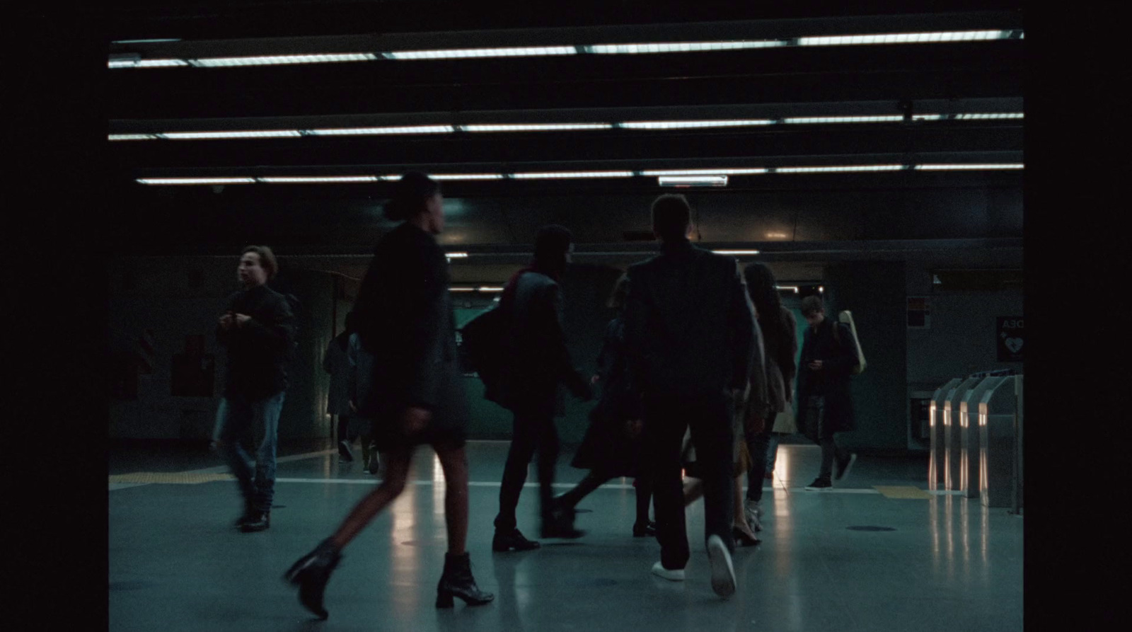 a group of people walking through a building