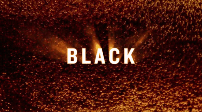 a close up of the word black on a dark background