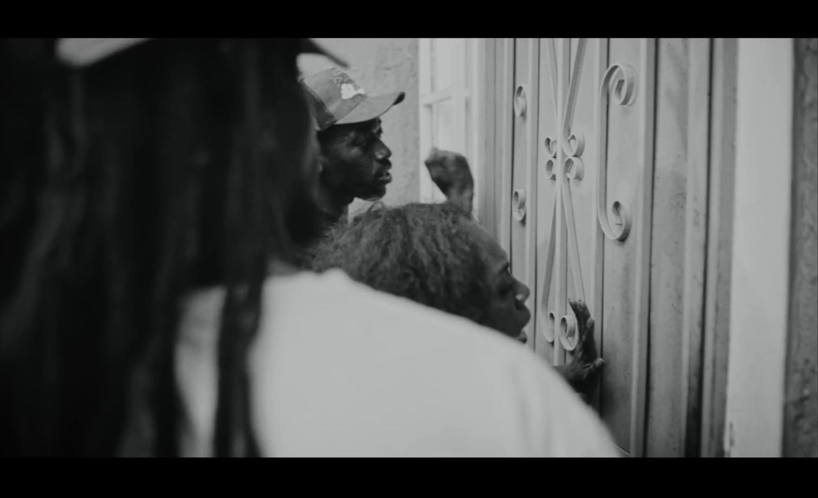 a man and a woman standing in front of a door