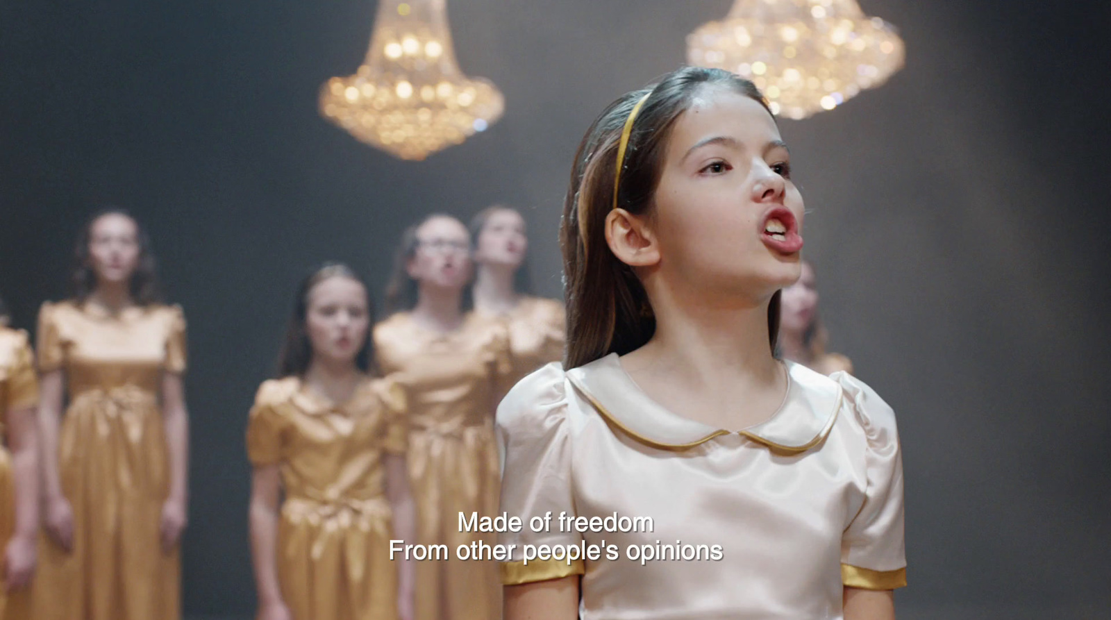 a group of young women standing next to each other