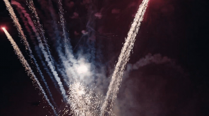 a bunch of fireworks are lit up in the night sky