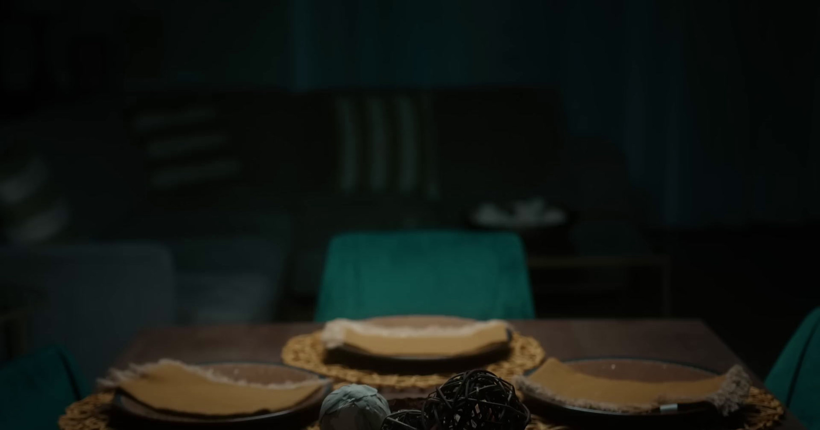 a wooden table topped with lots of plates